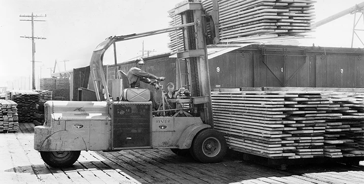 1930’s jumbo lift truck with pneumatic tires and a telescoping mast.