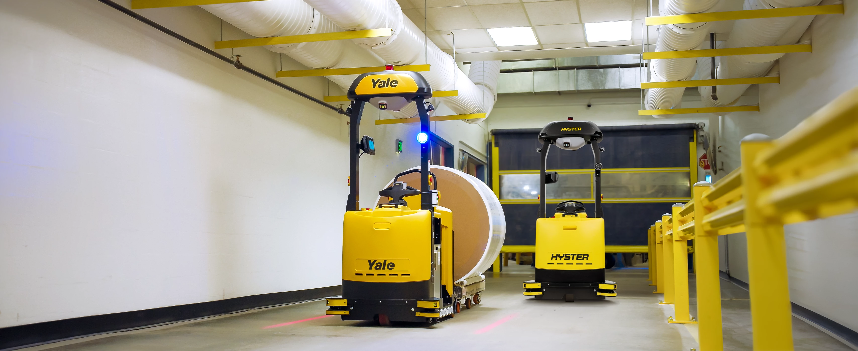 Yale Relay and Hyster Atlas automated tow tractor in operation.  
