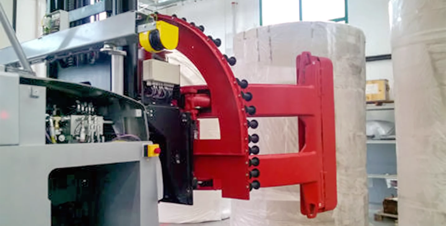 AGV with automated paper clamp approaching a paper roll. 