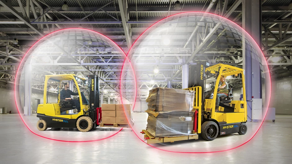 Two forklifts with Hyster Reaction automatically slowing as approach each other.